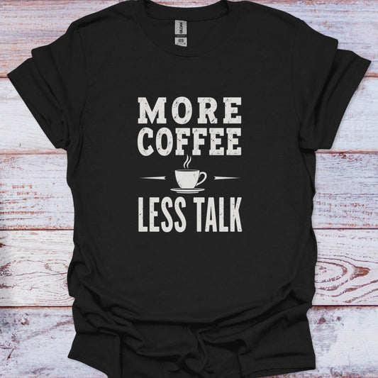 Black t-shirt with 'More Coffee Less Talk' text on a wooden surface