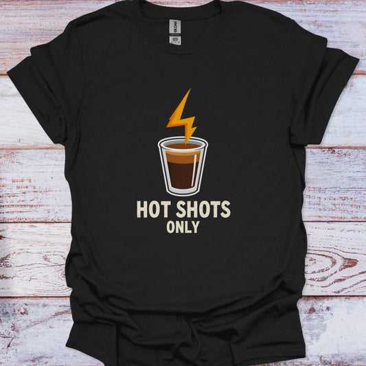 Black t-shirt with a graphic of a shot glass and 'Hot Shots Only' text on a wooden surface