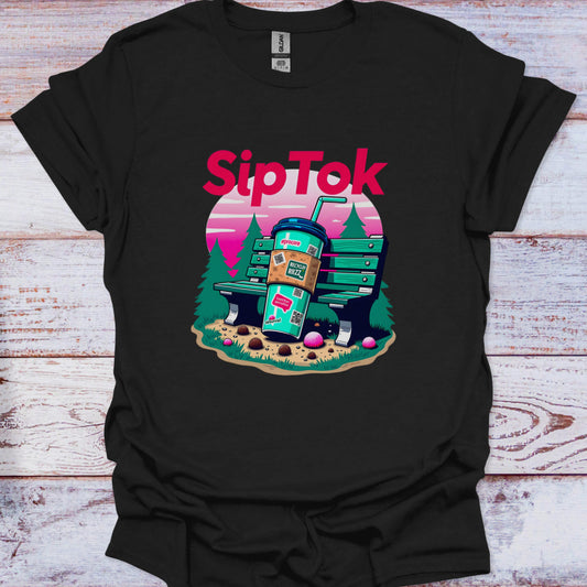 Black t-shirt with 'Sip Tok' graphic design featuring a coffee cup and trees on a wooden surface.