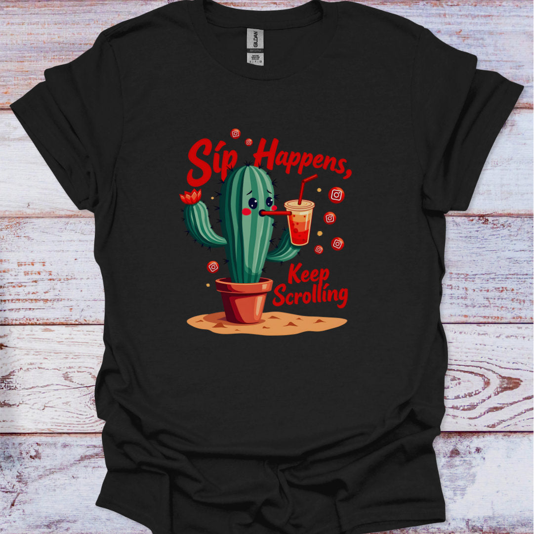 Black t-shirt with a cactus graphic and text 'Sip Happens, Keep Scrolling' on a wooden surface.