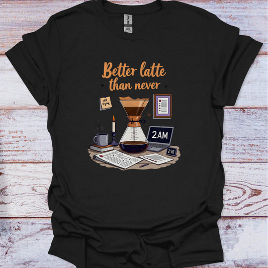 Black t-shirt with coffee-themed graphic and text 'Better latte than never' on a wooden surface.