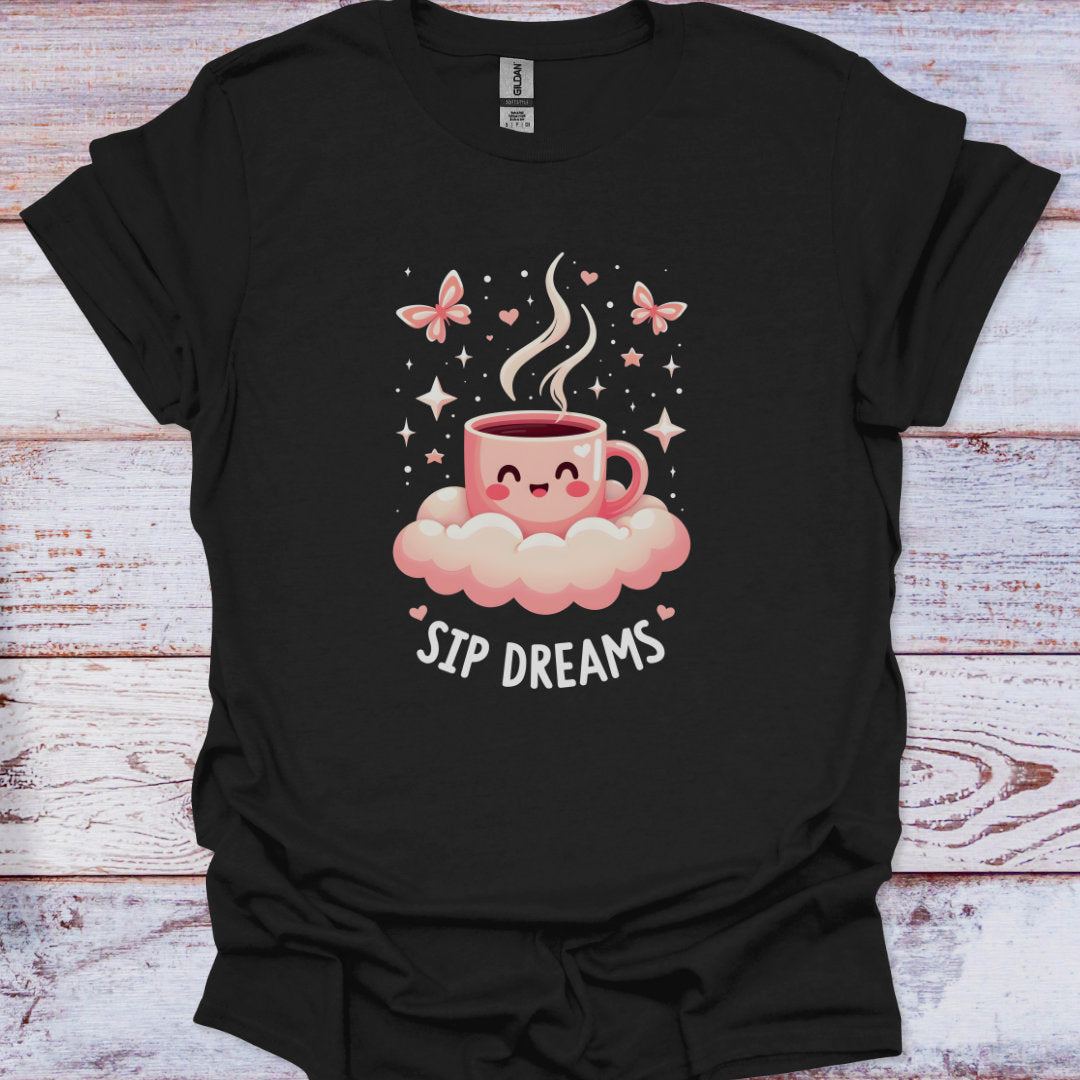Black t-shirt with a pink coffee cup graphic and 'Sip Dreams' text on a wooden surface