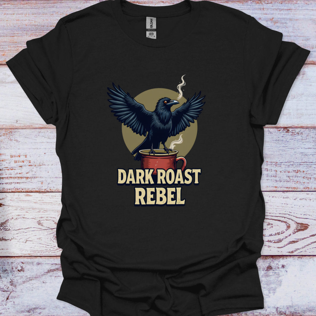 Black t-shirt with a crow design and 'Dark Roast Rebel' text on a wooden surface
