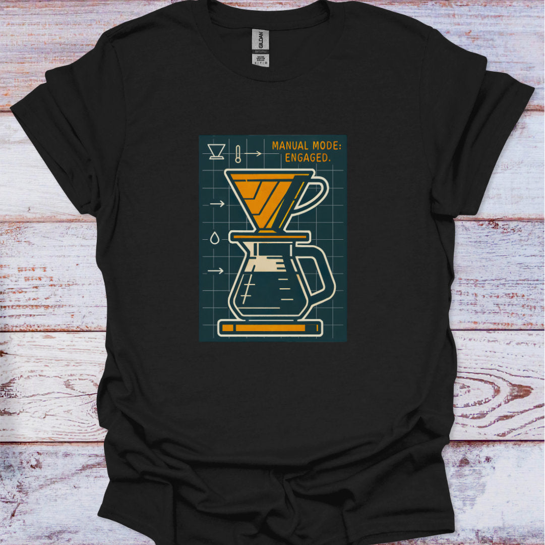Black t-shirt with a coffee brewing graphic on a wooden surface