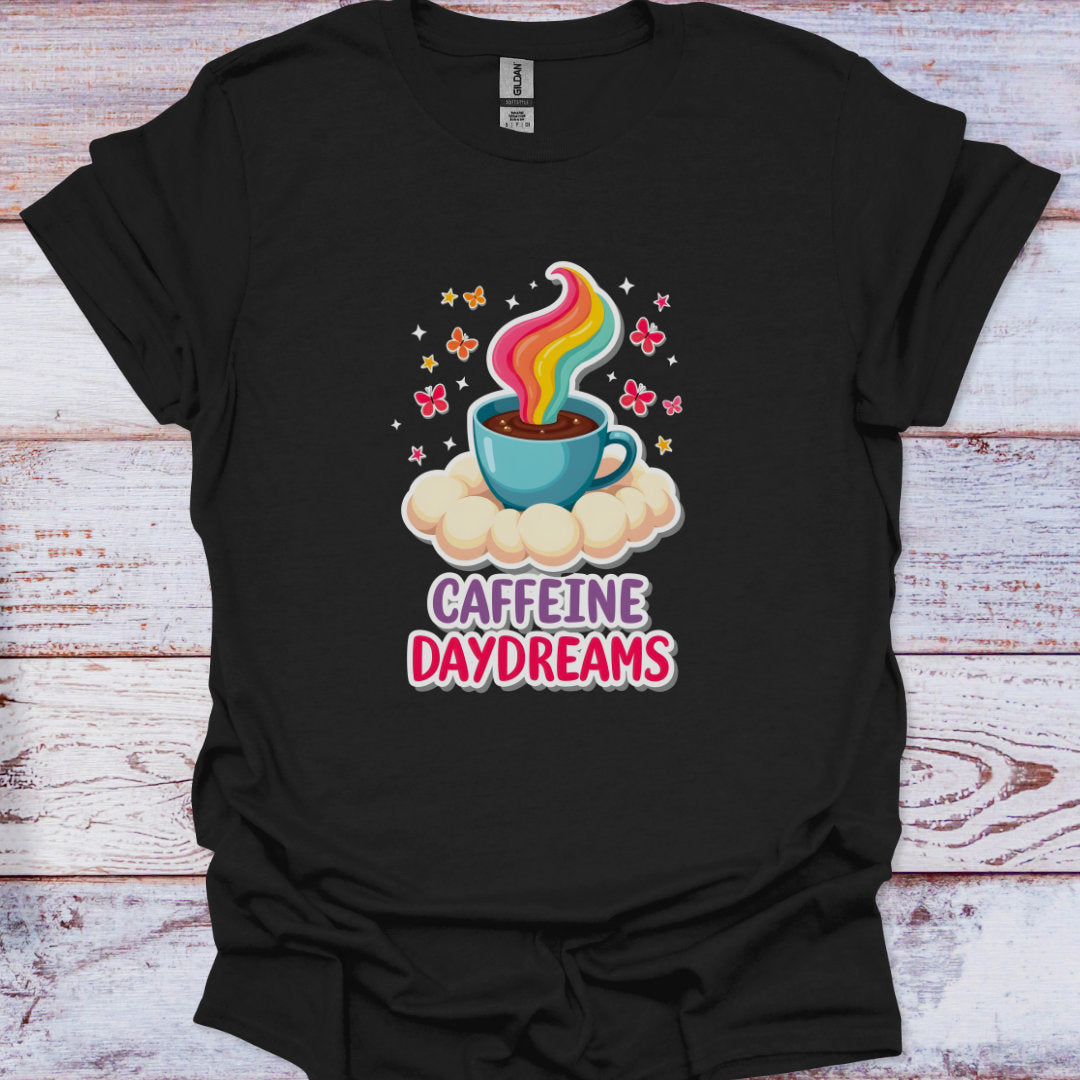 Black t-shirt with a colorful coffee cup graphic and 'Caffeine Daydreams' text on a wooden surface.