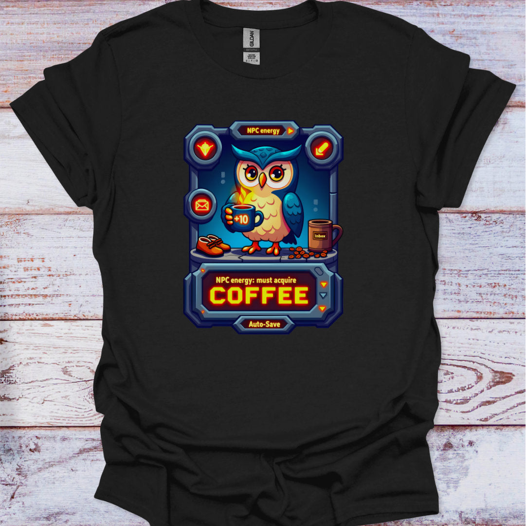 Black t-shirt with a colorful graphic of an owl holding a coffee cup on a wooden surface