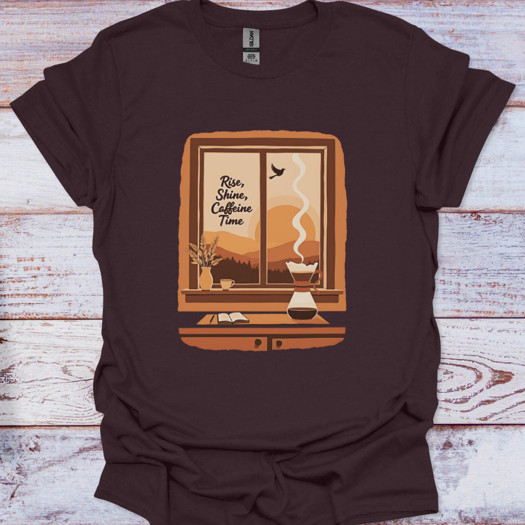 Brown t-shirt with a graphic design of a window, coffee maker, and text on a wooden surface.