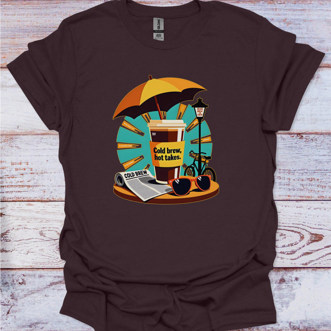 Brown t-shirt with a graphic design of a coffee cup, umbrella, and bicycle on a wooden surface.