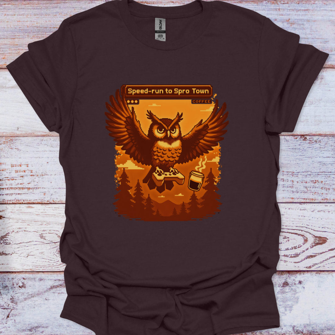 Brown t-shirt with an owl graphic and text on a wooden surface