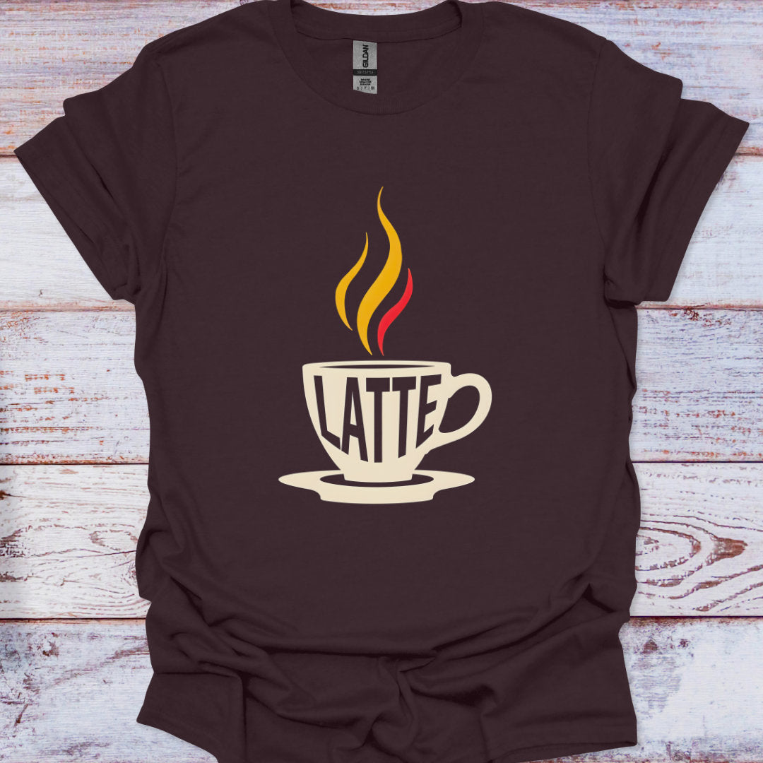 Brown t-shirt with a graphic of a coffee cup and the word 'Latte' on a wooden surface