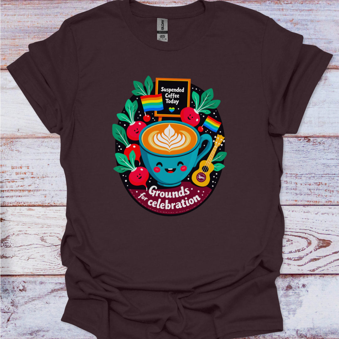 Brown t-shirt with a colorful coffee-themed graphic on a wooden surface