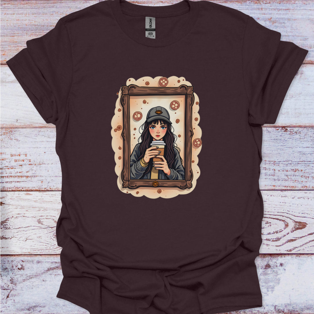 Brown t-shirt with an illustration of a woman holding a coffee cup on a wooden surface