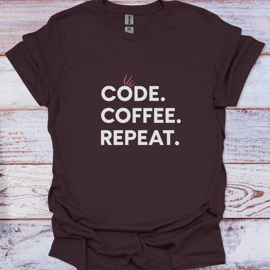 Brown t-shirt with 'CODE. COFFEE. REPEAT.' text on a wooden surface