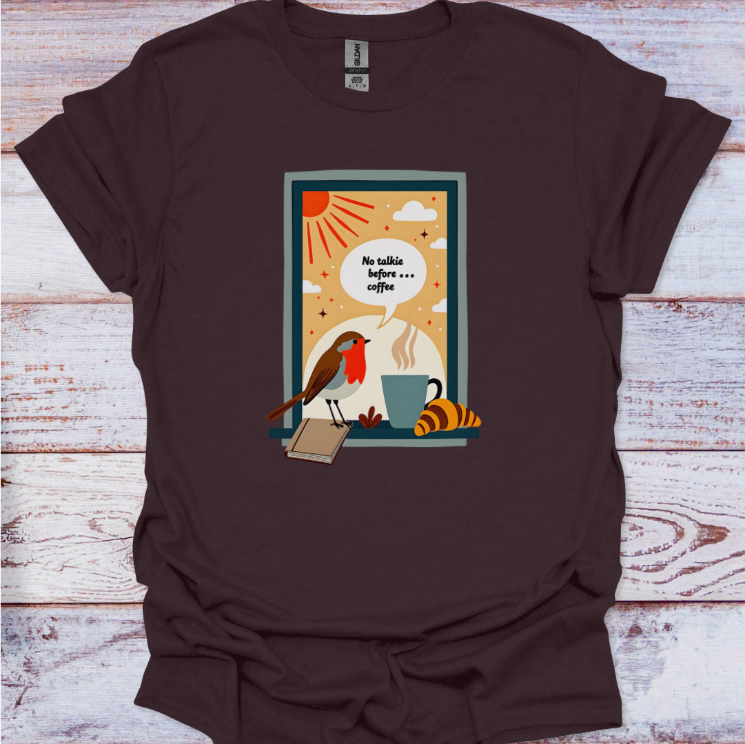 Brown t-shirt with a colorful graphic design on a wooden surface