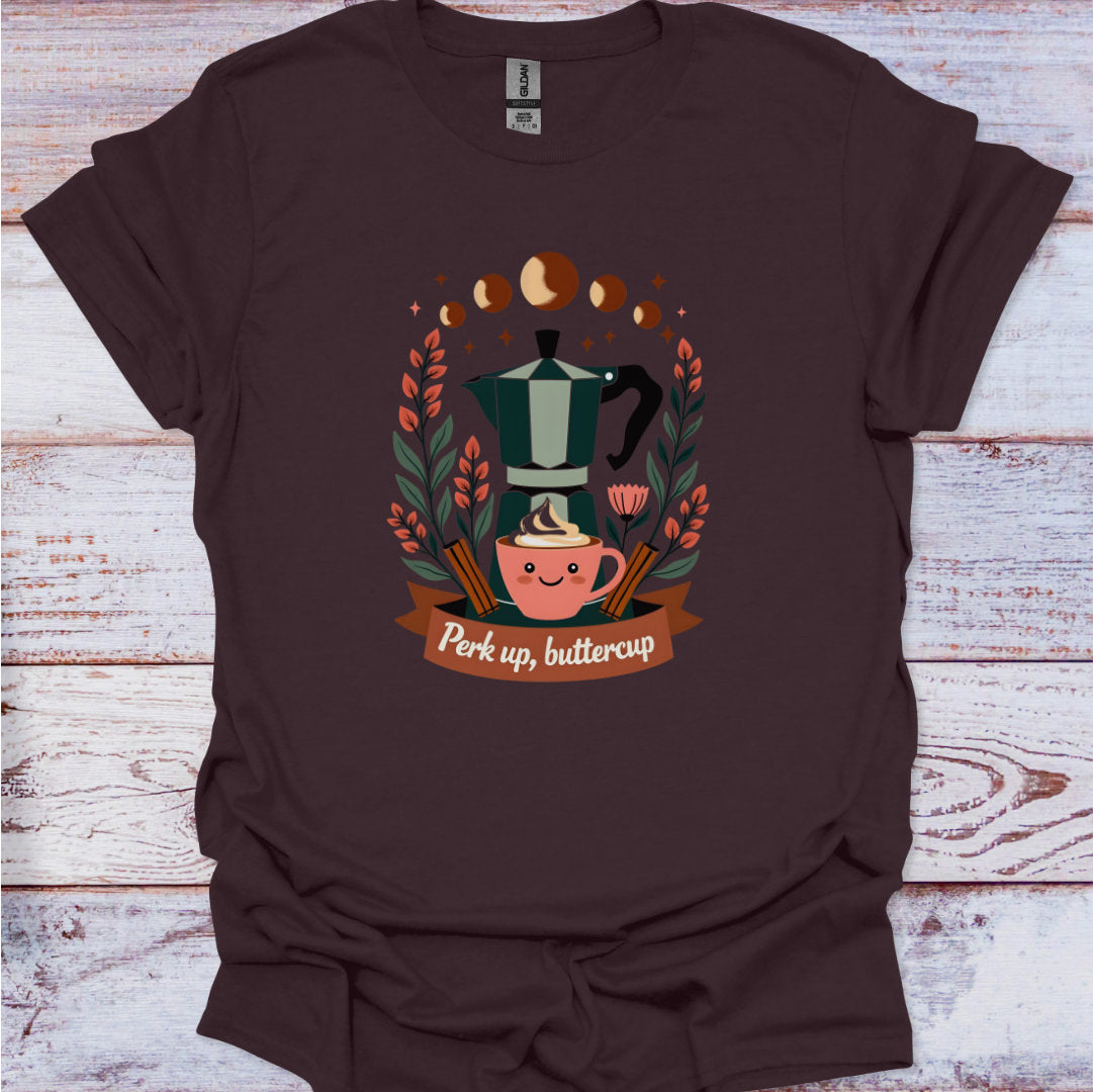 Brown t-shirt with a coffee-themed graphic and text on a wooden surface