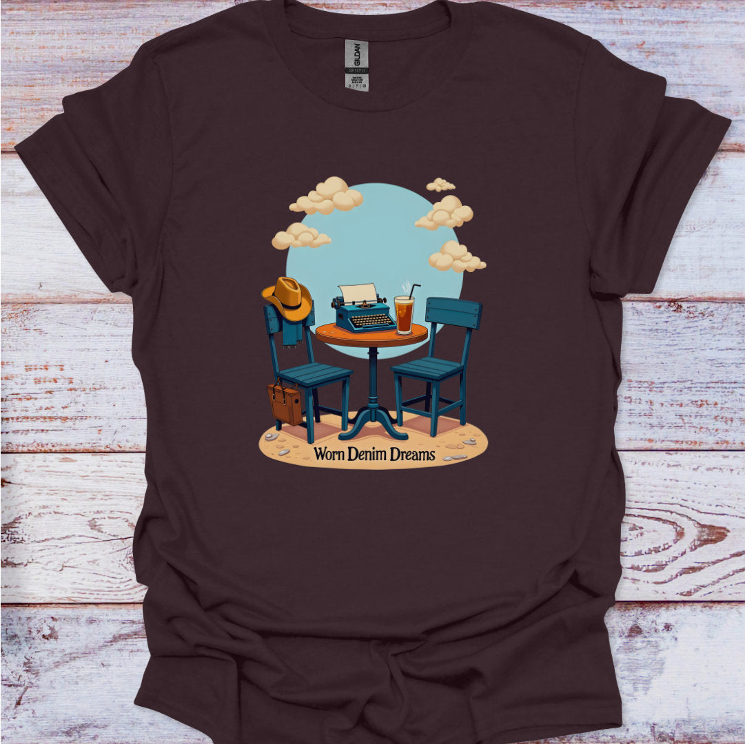 Brown t-shirt with a graphic of two chairs around a table, a typewriter, and a cowboy hat on a wooden surface.