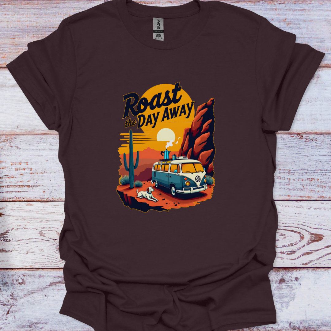 Brown t-shirt with a graphic design of a van and desert scene on a wooden surface