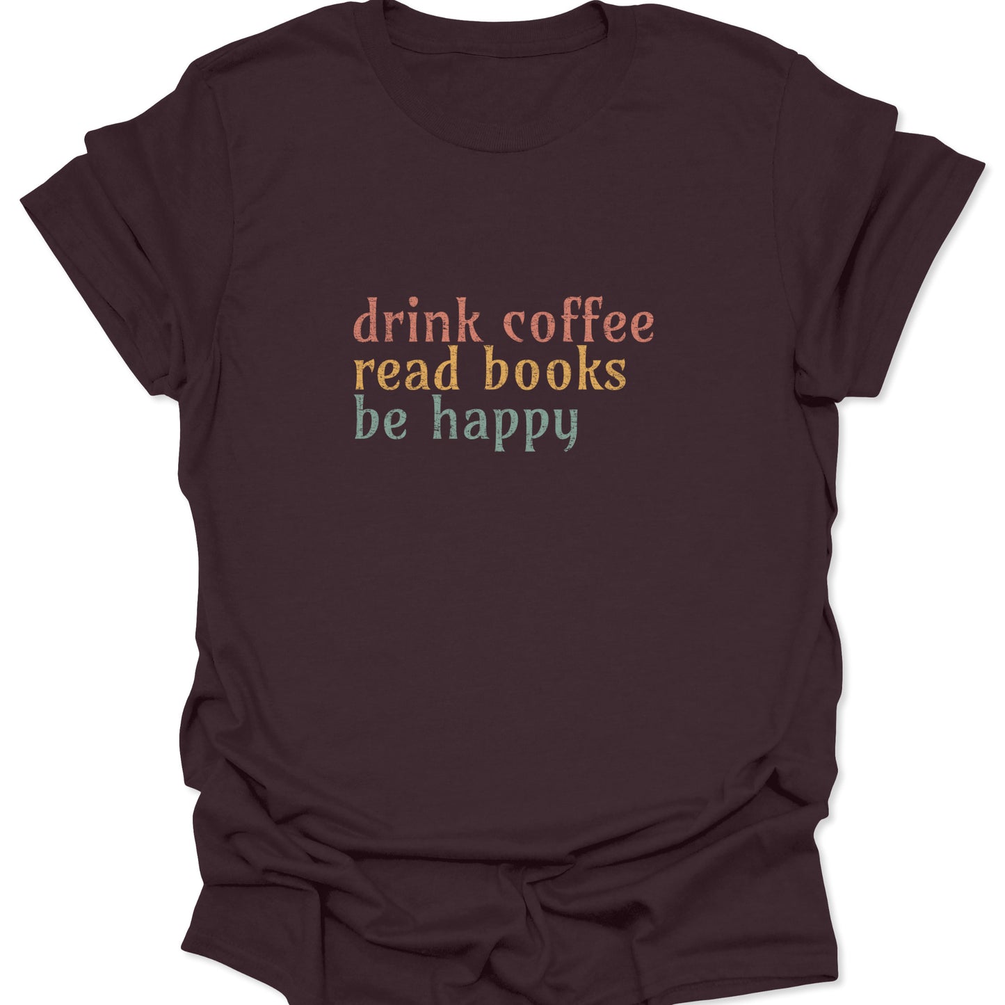 Dark chocolate brown t-shirt with a vintage-style "drink coffee read books be happy" graphic in muted sunset tones.