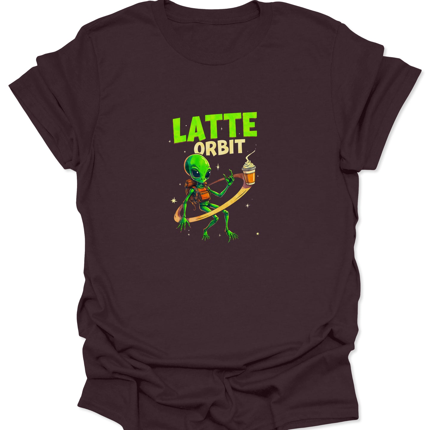 Dark Chocolate Brown: LATTE ORBIT design showing a small green alien on a gold ring, carefully holding a coffee cup. High-contrast space humor graphic.