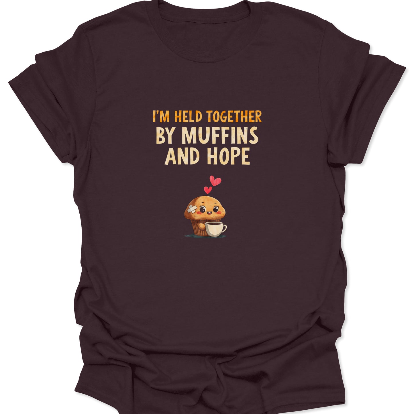 Dark Chocolate Brown t-shirt featuring text "Held Together By Muffins And Hope" in vintage orange font, foodie aesthetic.