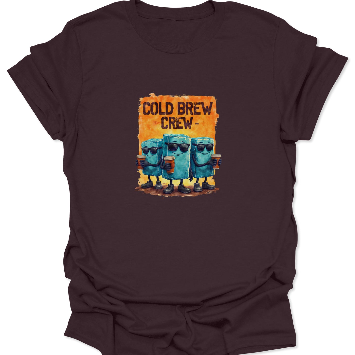 Dark Chocolate Brown shirt showcasing the Cold Brew Crew graphic: three anthropomorphic, cylindrical cold brew cubes with shades and coffee cups, set against a burnt orange frame.