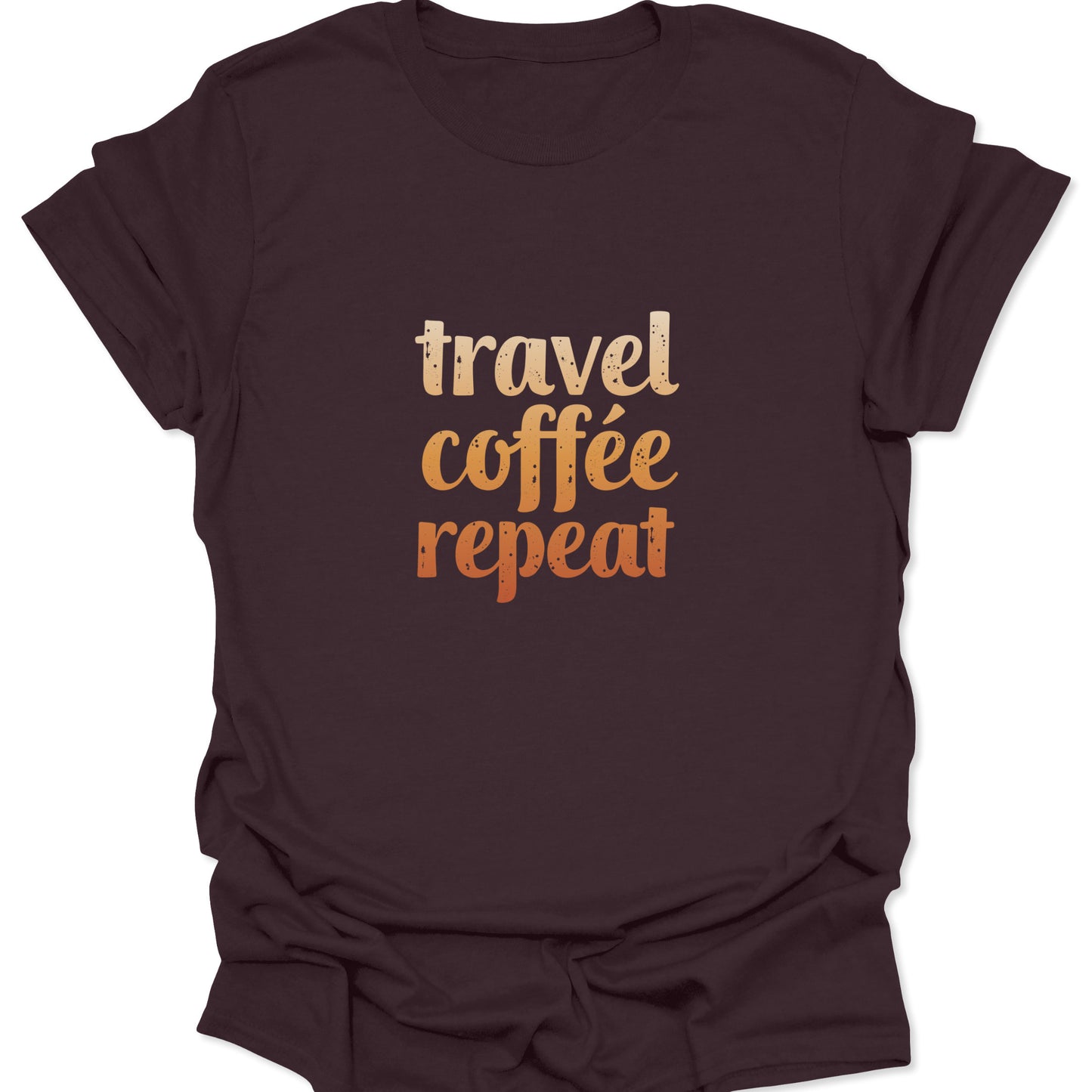 A dark brown t-shirt showing the "travel coffee repeat" design, where the warm orange text tones blend tonally with the chocolate fabric for a vintage look.