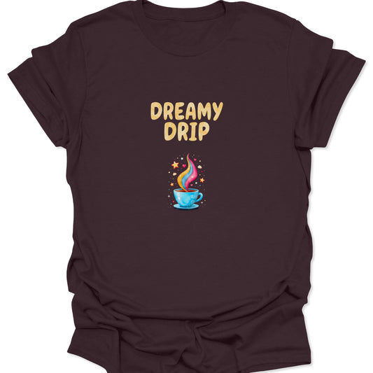 DREAMY DRIP graphic featuring a stylized, rainbow-steam coffee cup with small hearts and stars on a rich, dark brown apparel background.