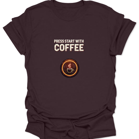 Dark Chocolate Brown, deep-tone graphic tee for coffee lovers featuring a retro arcade "Press Start" message and a caffeinated power-up symbol.