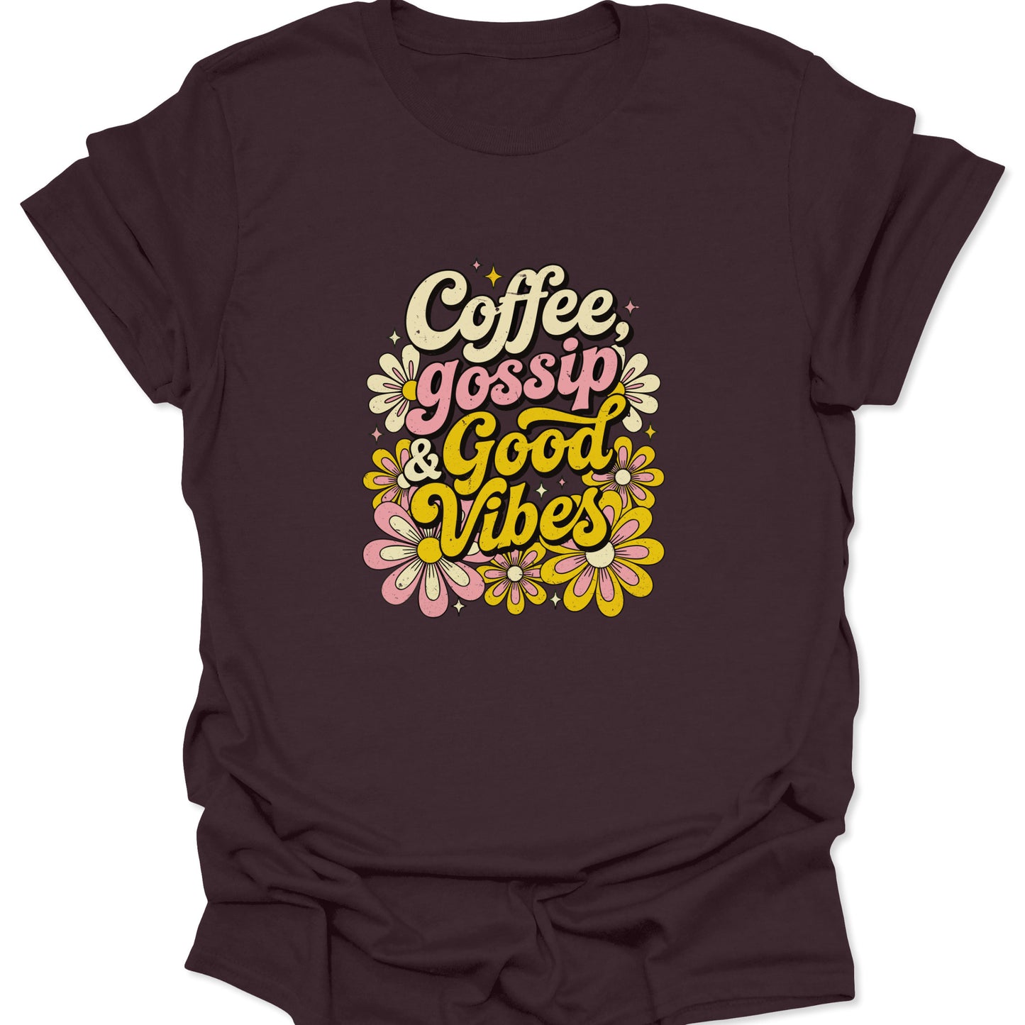 A dark chocolate brown t-shirt with a vintage 70s floral design and "Coffee, Gossip & Good Vibes" text in distressed mustard and pastel pink.
