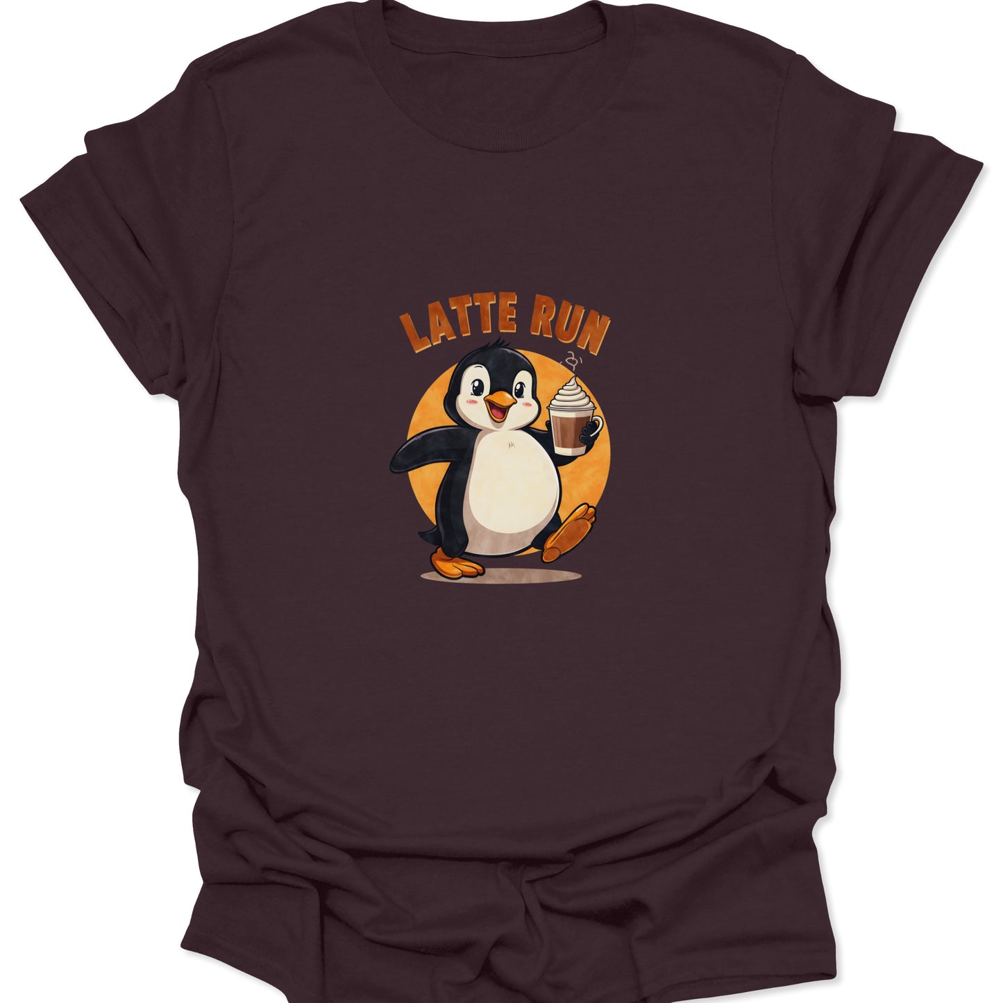 Dark brown tee featuring a determined, cheerful cartoon penguin on a coffee run holding a latte against an orange circular sun graphic.