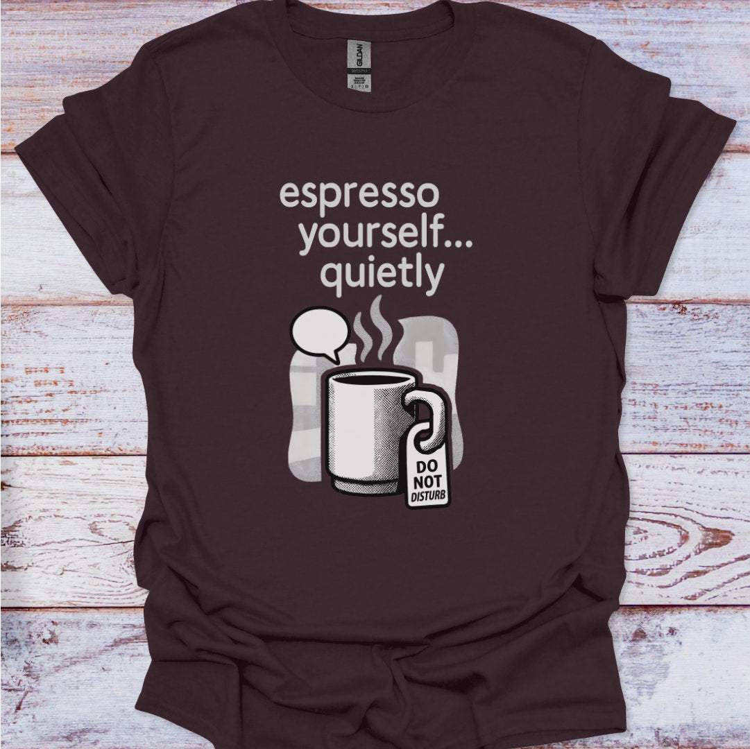 Brown t-shirt with coffee-themed graphic and text on a wooden surface