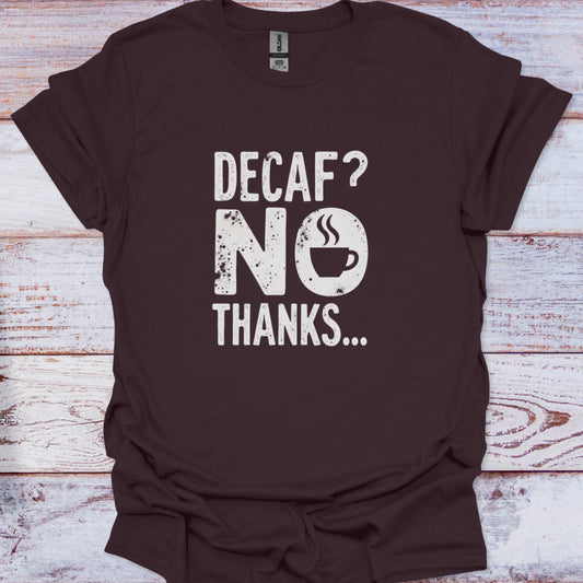 Brown t-shirt with 'Decaf? No Thanks...' text on a wooden surface