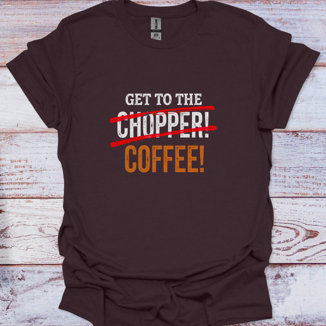 Brown t-shirt with text 'Get to the Chopper! Coffee!' on a wooden surface