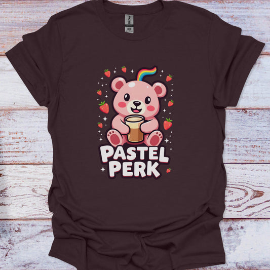 Brown t-shirt with a cartoon bear holding蜂蜜and 'Pastel Perk' text on a wooden surface