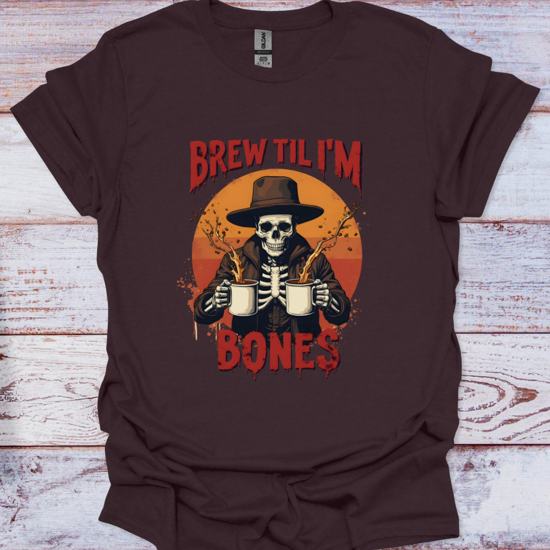 Brown t-shirt with a skeleton holding beer mugs and 'Brew Til I'm Bones' text on a wooden surface