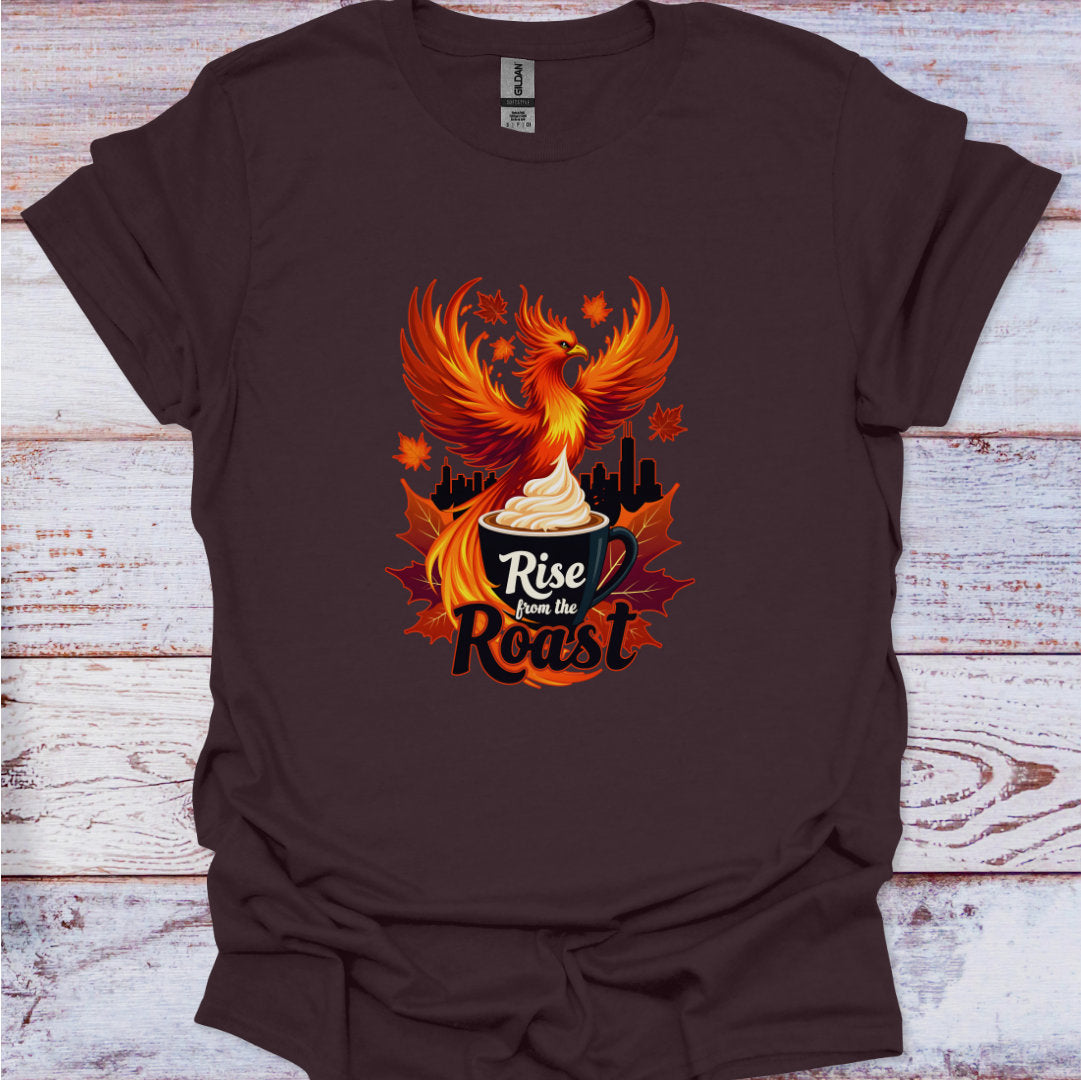 Brown t-shirt with a phoenix design and 'Rise from the Roast' text on a wooden surface