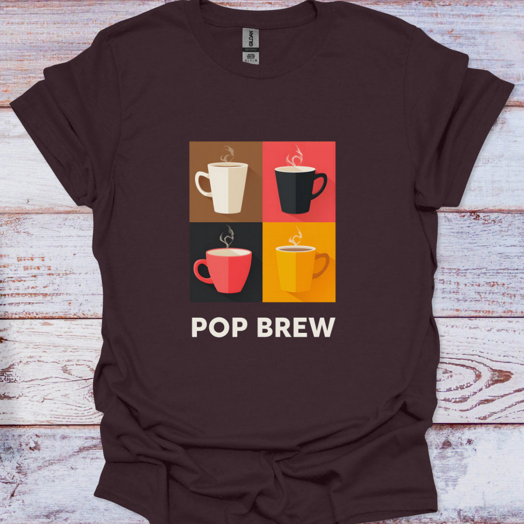 Brown t-shirt with colorful coffee cup graphic and 'POP BREW' text on a wooden surface