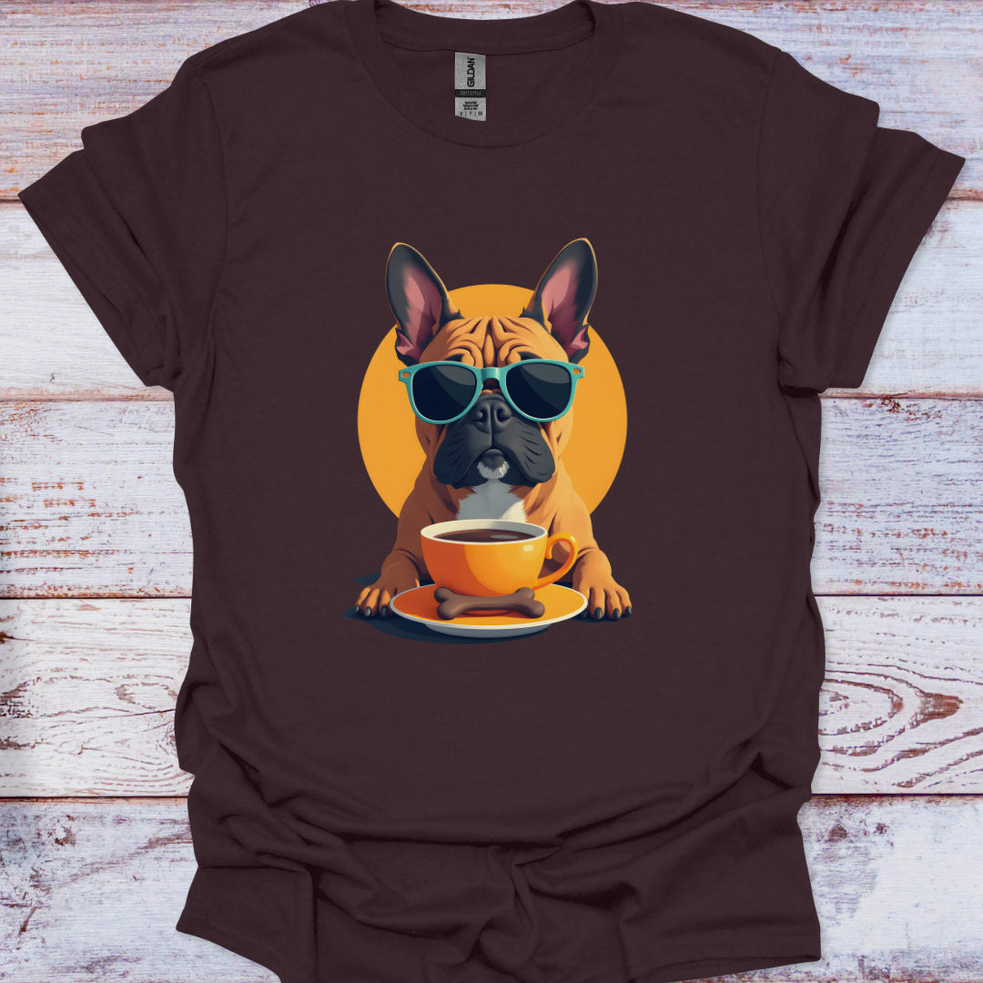 Brown t-shirt with a graphic of a dog wearing sunglasses and holding a coffee cup on a wooden surface.