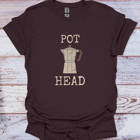 Brown t-shirt with 'POT HEAD' and coffee pot graphic on a wooden surface