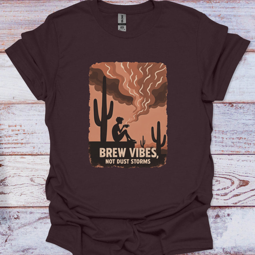 Brown t-shirt with a graphic design featuring a cactus and text on a wooden surface