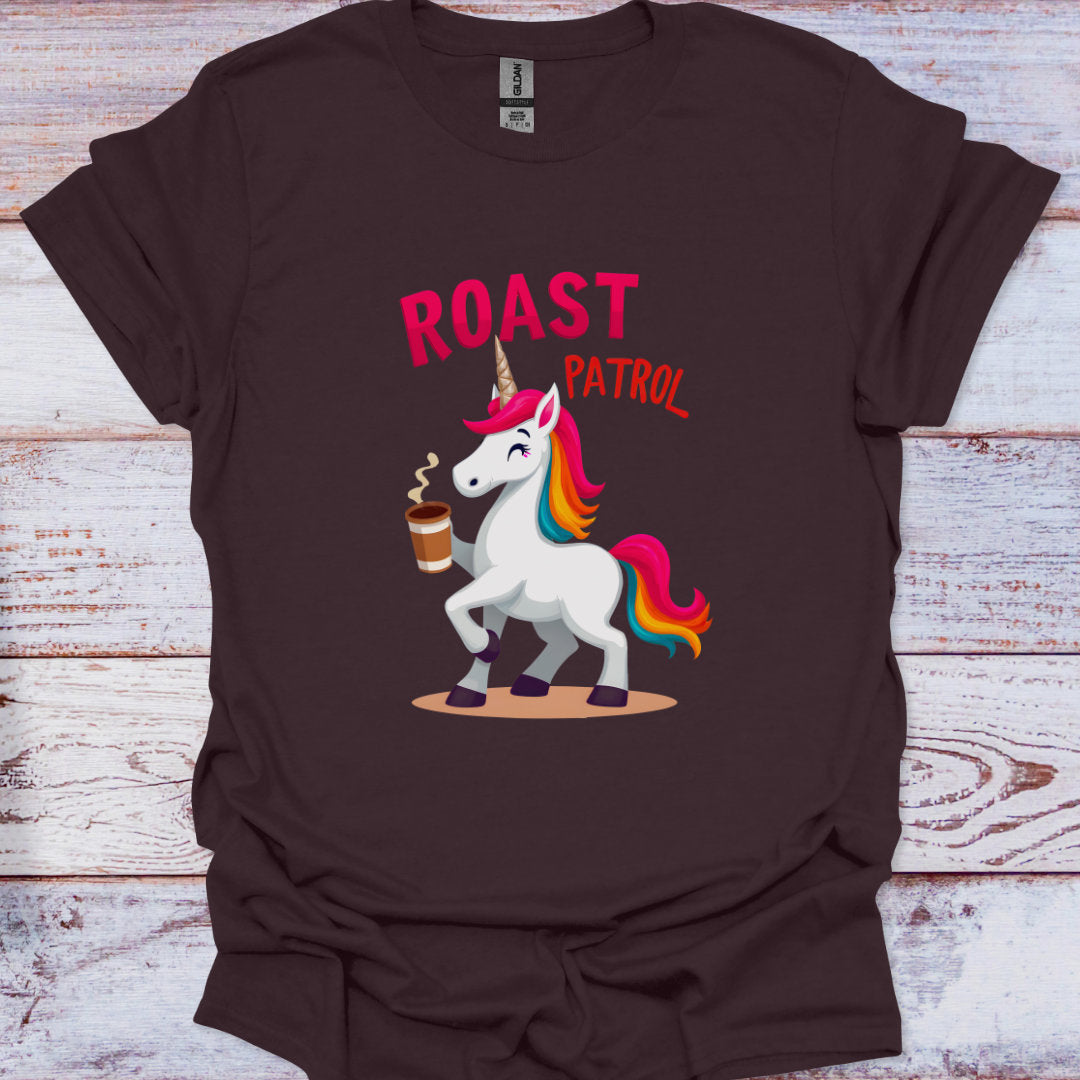 Brown t-shirt with a unicorn graphic and 'Roast Patrol' text on a wooden surface