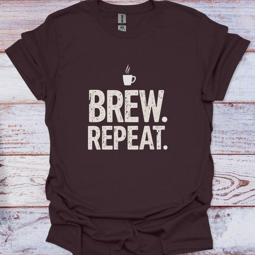 Brown t-shirt with 'Brew. Repeat.' text on a wooden surface