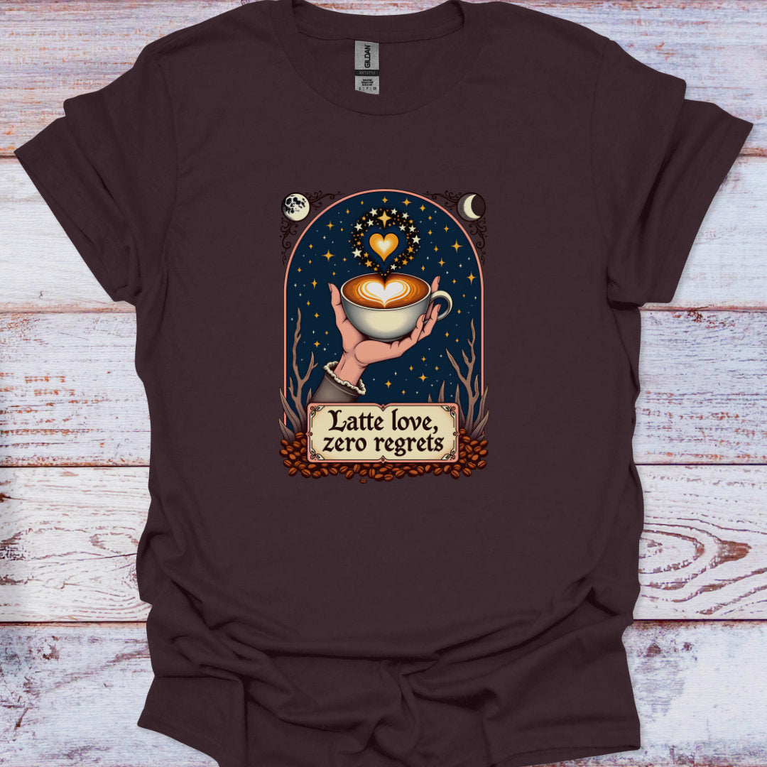 Brown t-shirt with a graphic of a hand holding a coffee cup and text 'Latte love, zero regrets' on a wooden surface.