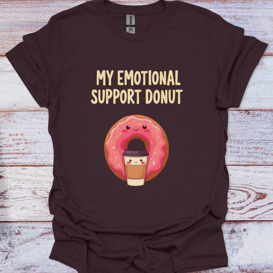 Brown t-shirt with a cartoon donut and coffee cup graphic and text 'My Emotional Support Donut' on a wooden surface.