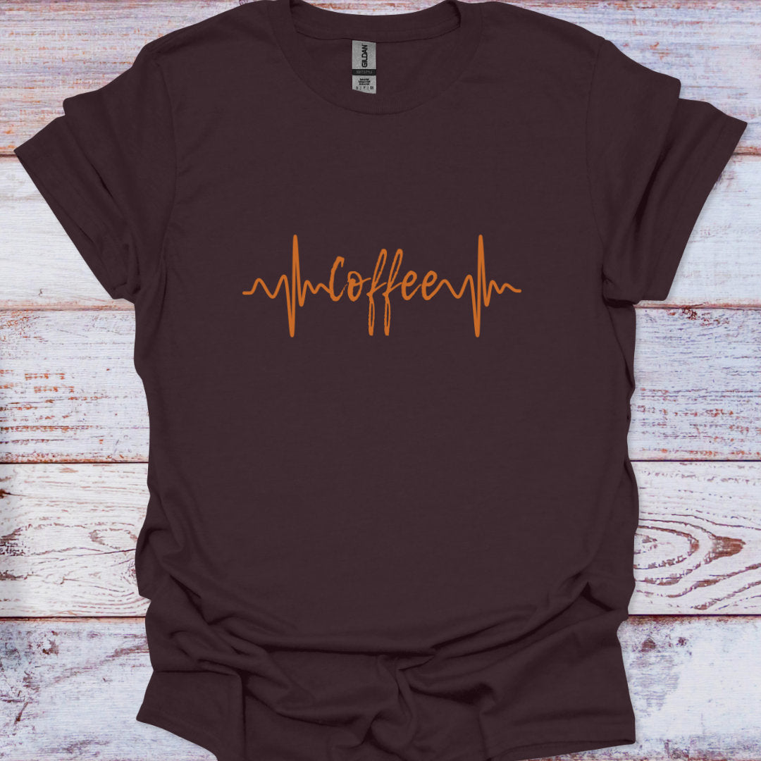 Brown t-shirt with 'coffee' design on a wooden surface