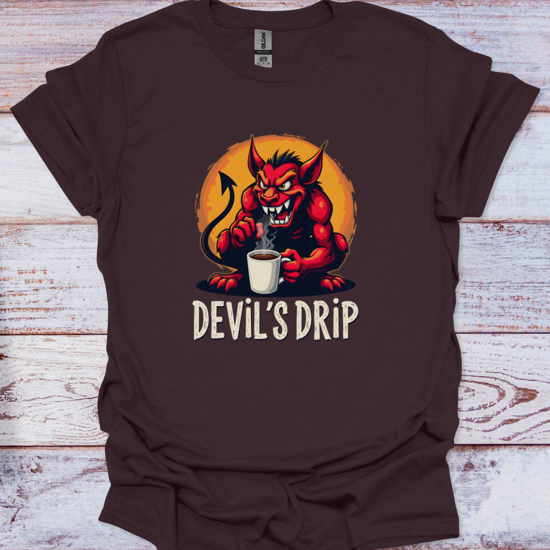 Brown t-shirt with a devil holding a coffee cup and 'DEVIL'S DRIP' text on a wooden surface.