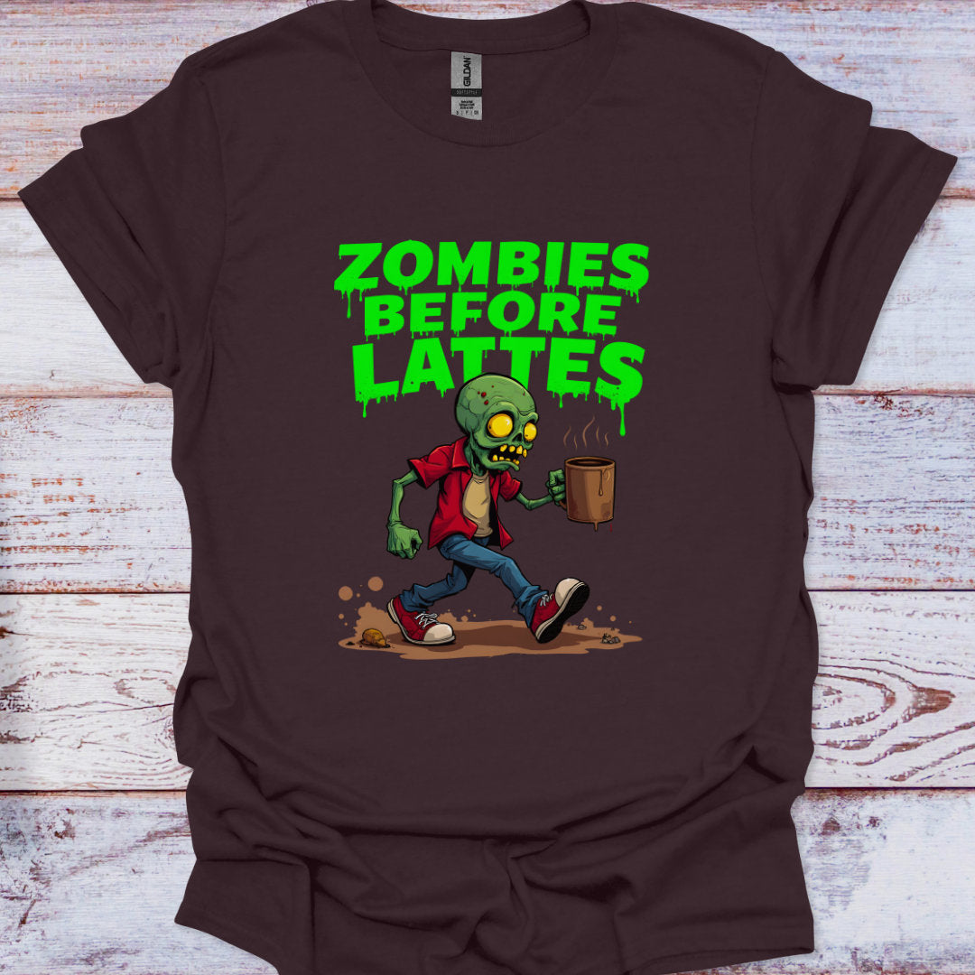 Brown t-shirt with a zombie graphic and 'Zombies Before Lattes' text on a wooden surface