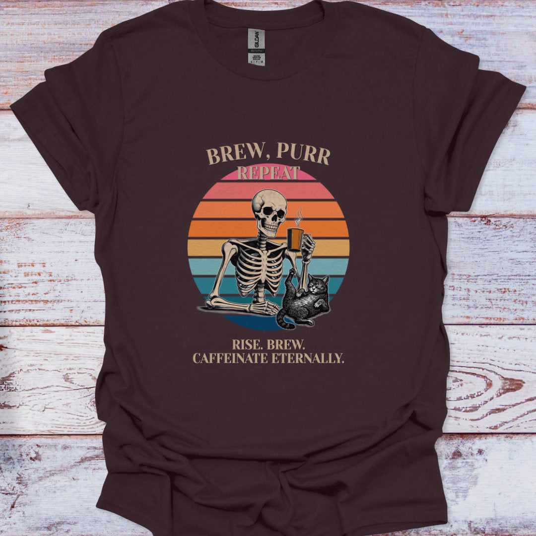 Brown t-shirt with skeleton and cat design on a wooden surface