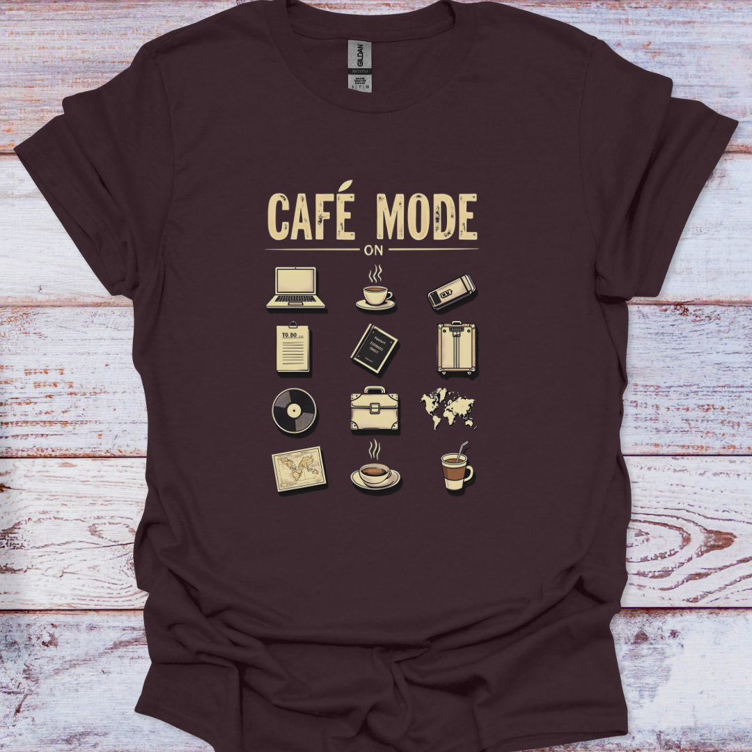 Brown t-shirt with 'Café Mode On' graphic design on a wooden surface