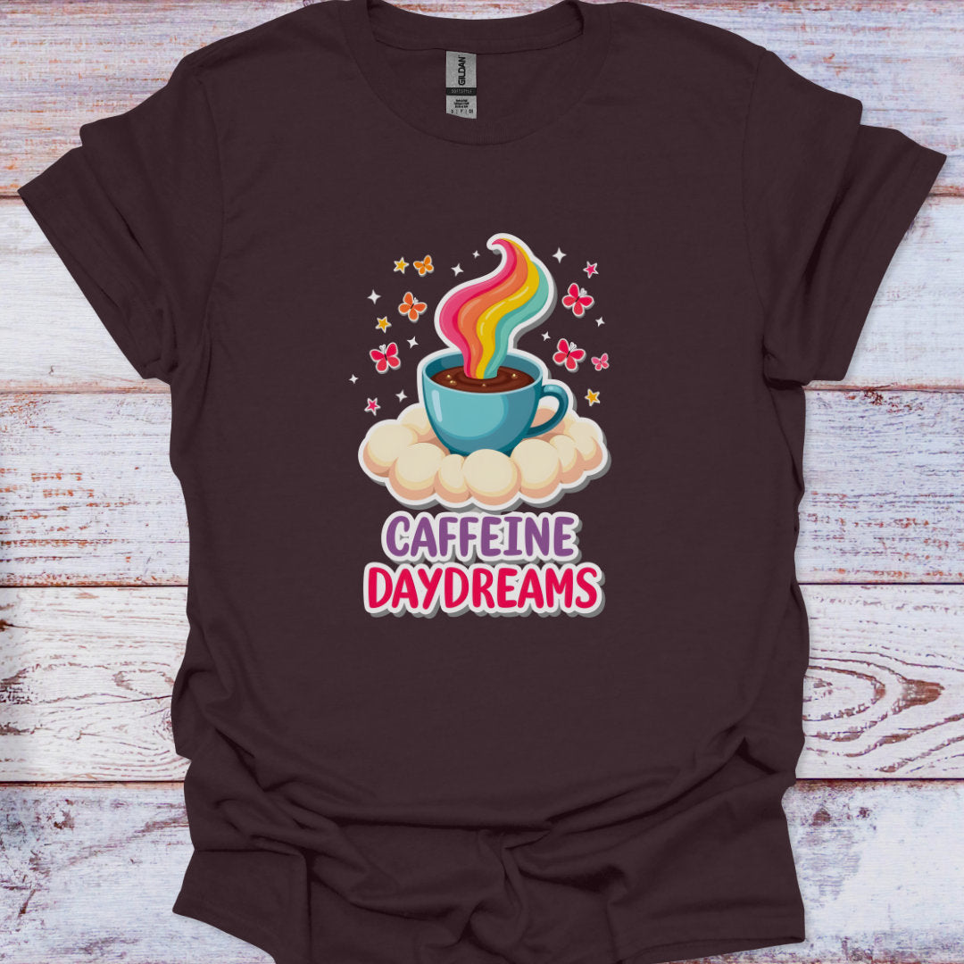 Brown t-shirt with a colorful coffee cup graphic and 'Caffeine Daydreams' text on a wooden surface.